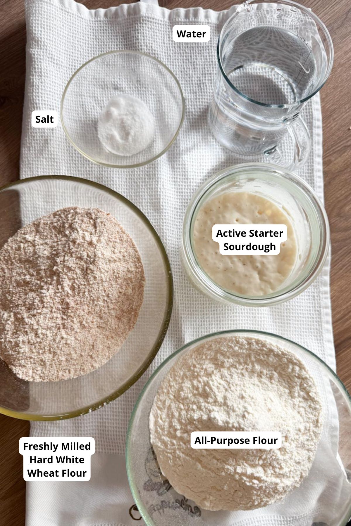 High-quality all-purpose flour, fresh milled white wheat, and active sourdough starter for baking recipes.