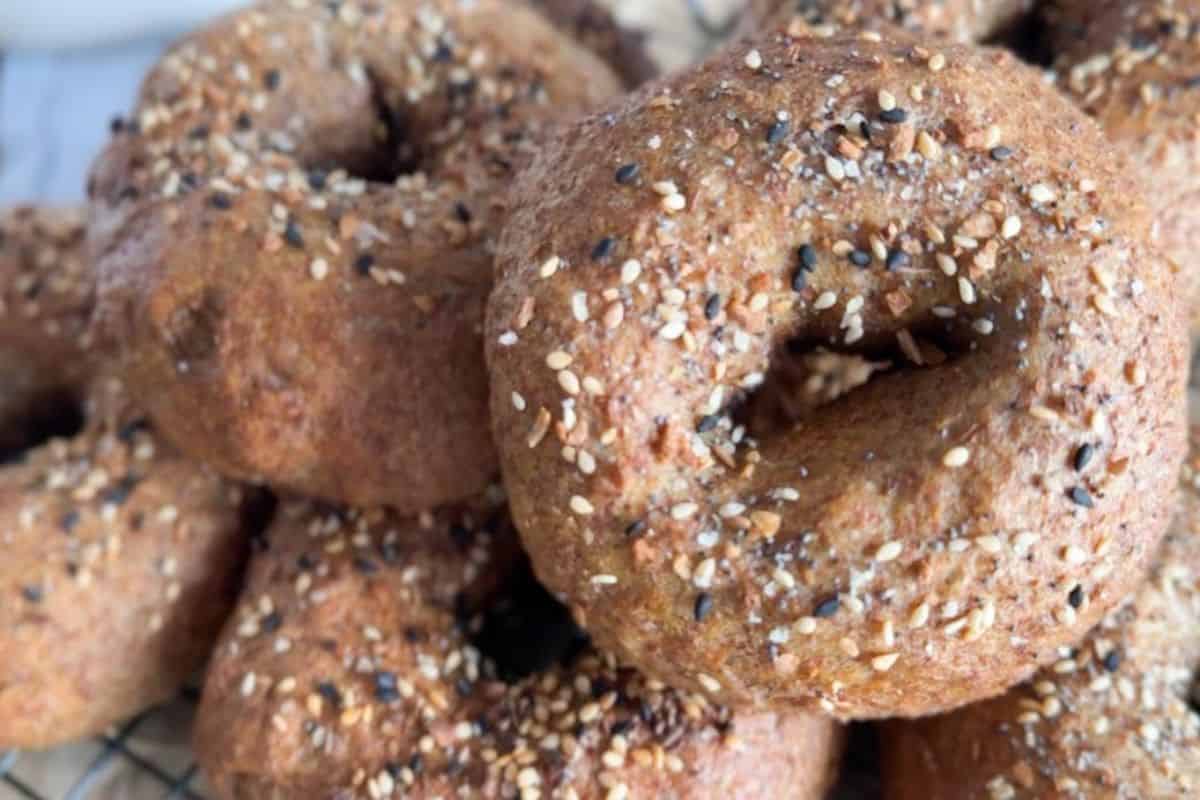 Delicious freshly baked bagels coated with a mix of sesame and poppy seeds, made with freshly milled ingredients.