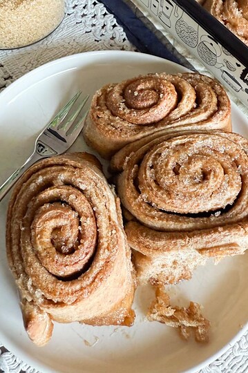 Delicious homemade cinnamon rolls made with fresh milled whole wheat flour, perfect for wholesome breakfast treats.