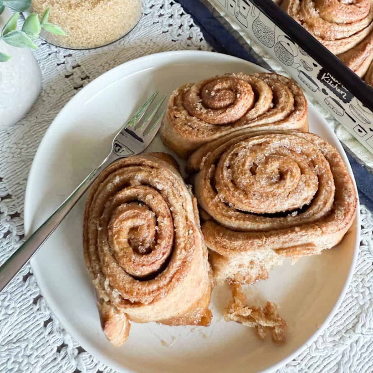 Delicious homemade cinnamon rolls made with fresh milled whole wheat flour, perfect for wholesome breakfast treats.