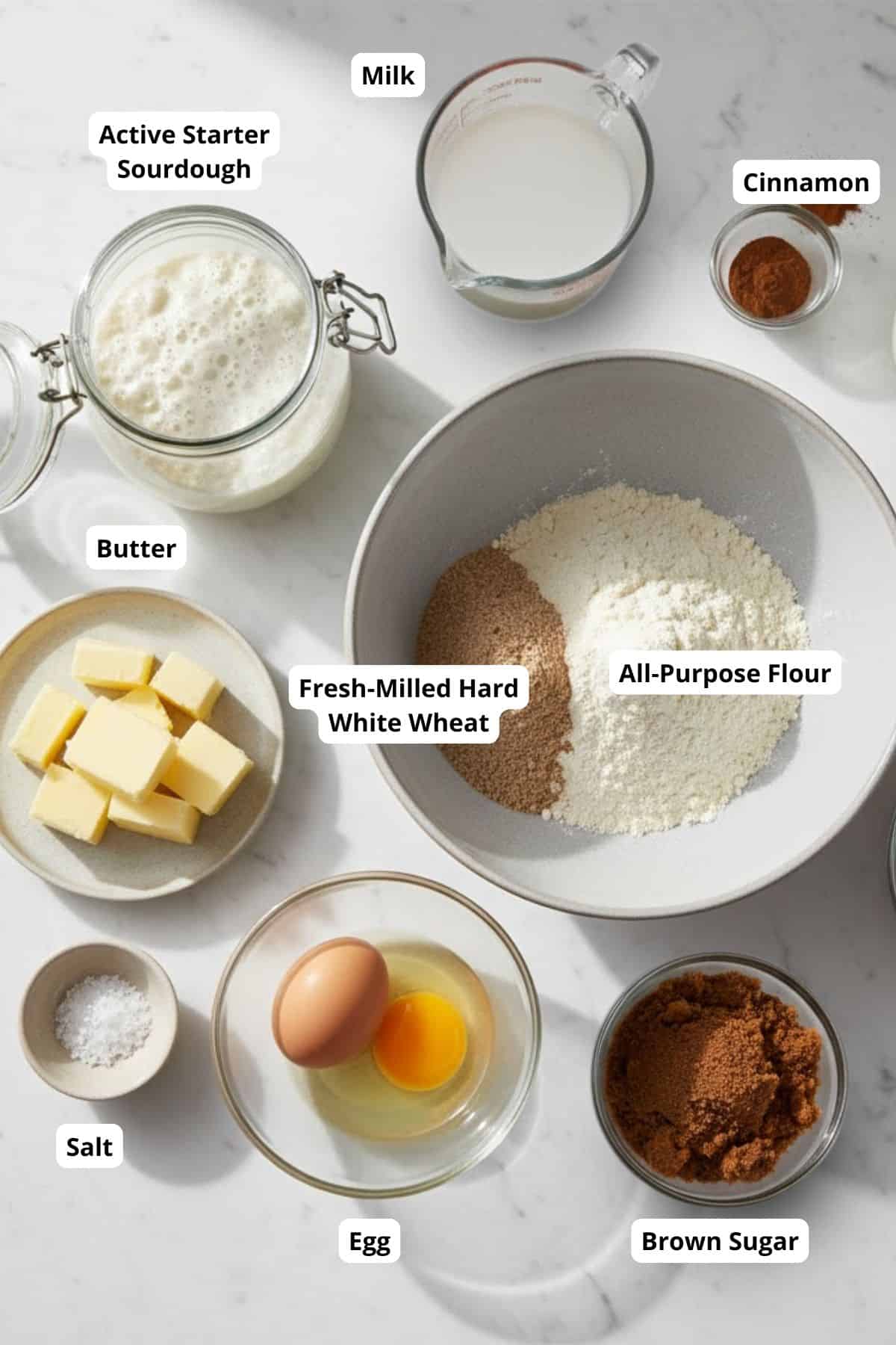 Fresh milled white wheat flour, butter, eggs, milk, cinnamon, salt, and brown sugar for homemade baked goods.