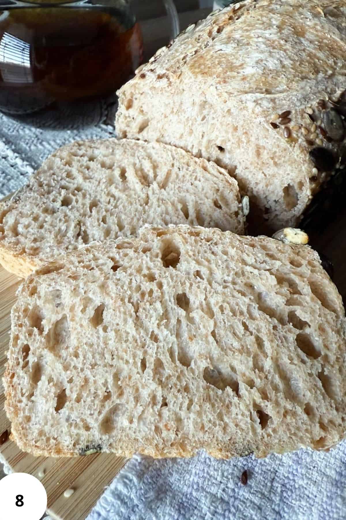Freshly baked sourdough bread with a crusty exterior and airy interior, made from freshly milled grains.