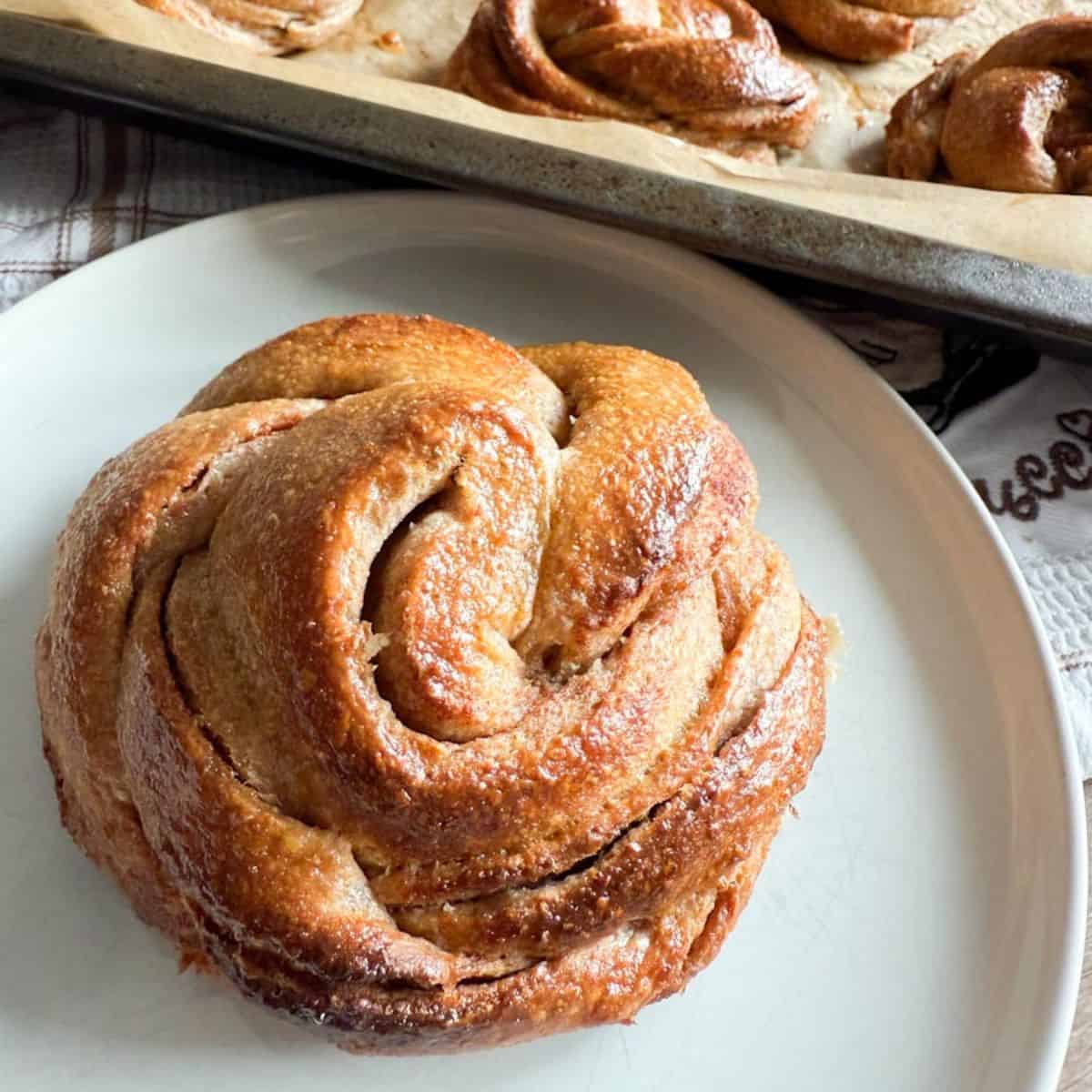 Delicious freshly baked cinnamon roll made with fresh milled flour, perfect for breakfast or snack.