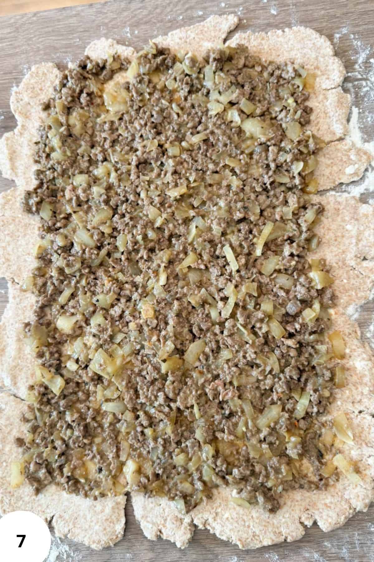 Hearty millet filling with ground meat and onions for healthy, gluten-free dishes. Perfect for baking or cooking.