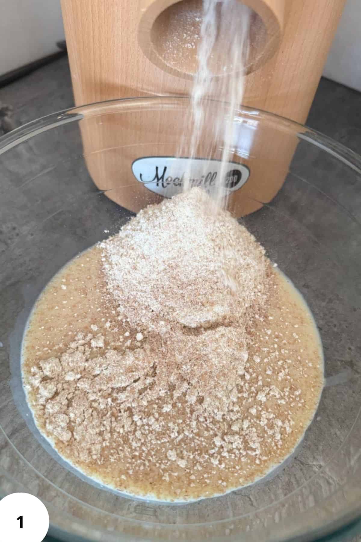 Natural flour being added to fresh homemade bread dough for healthy baking.