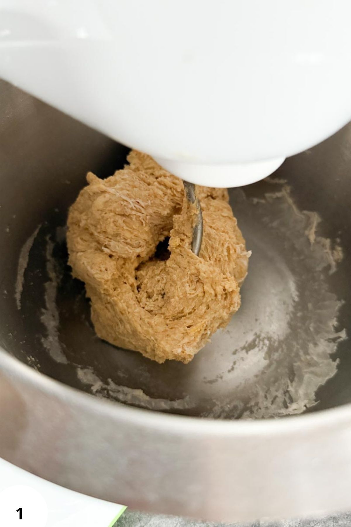 Fresh milled flour dough in mixer for healthy homemade bread.