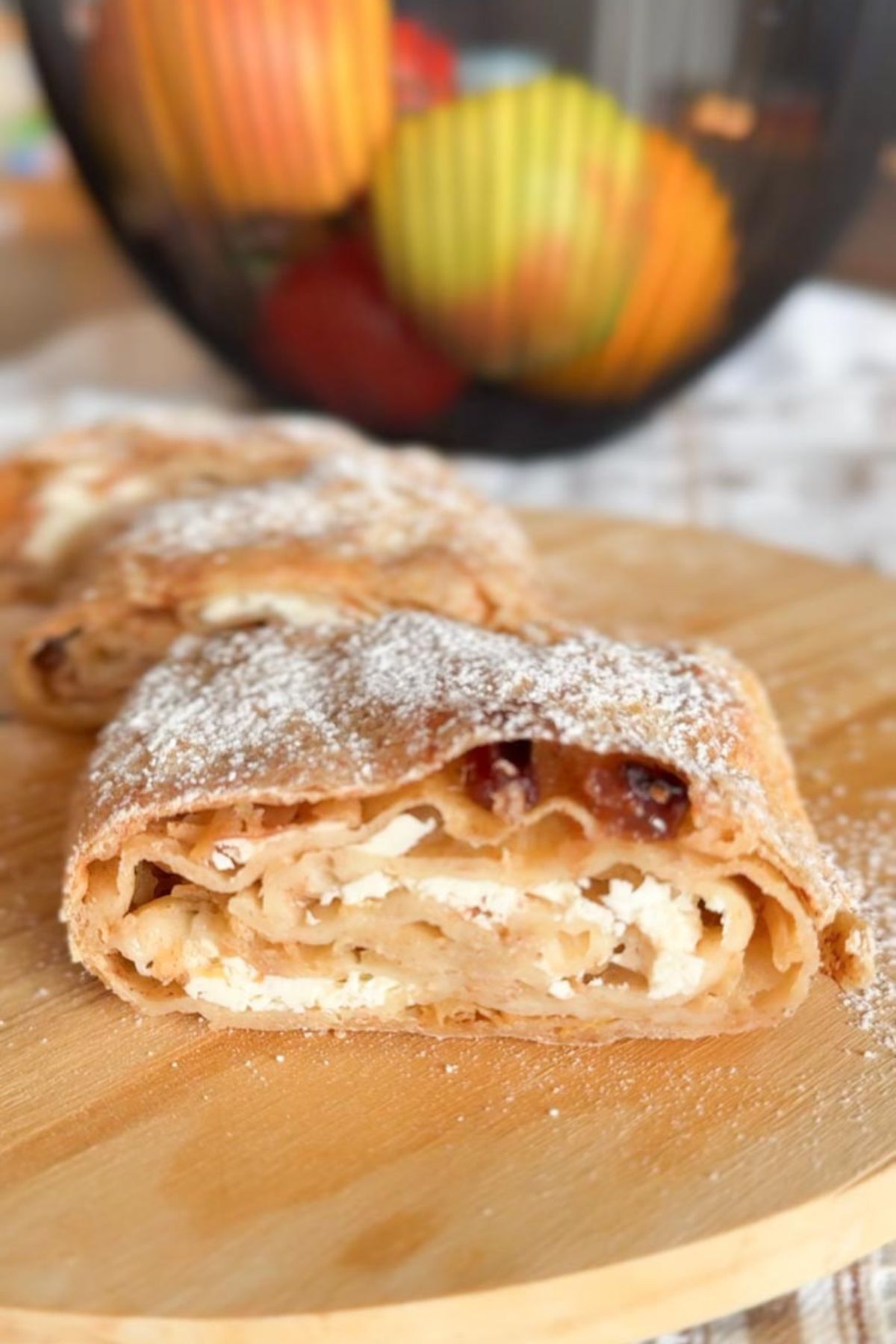 Delicious apple-filled pastry with powdered sugar perfect for breakfast or snacks.