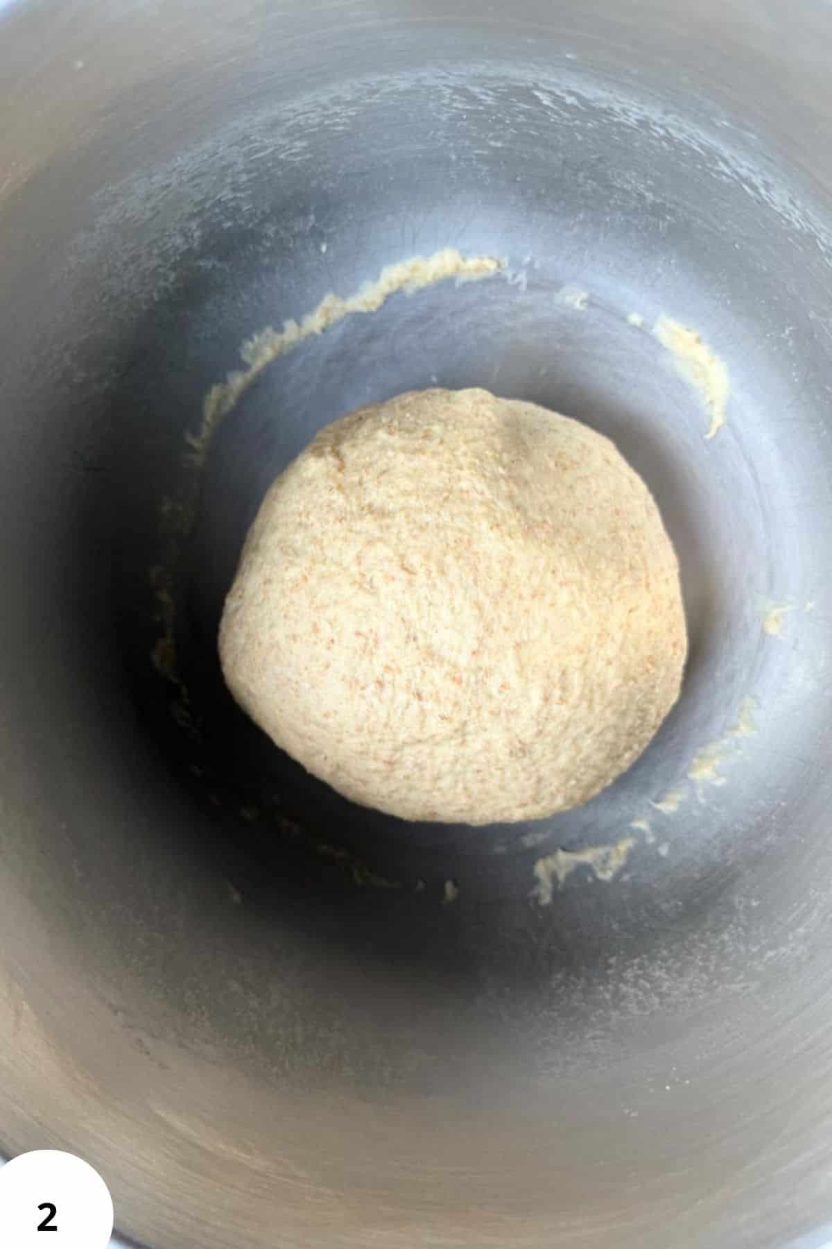Healthy homemade bread dough post-grinding with fresh milled grains in a bread maker.