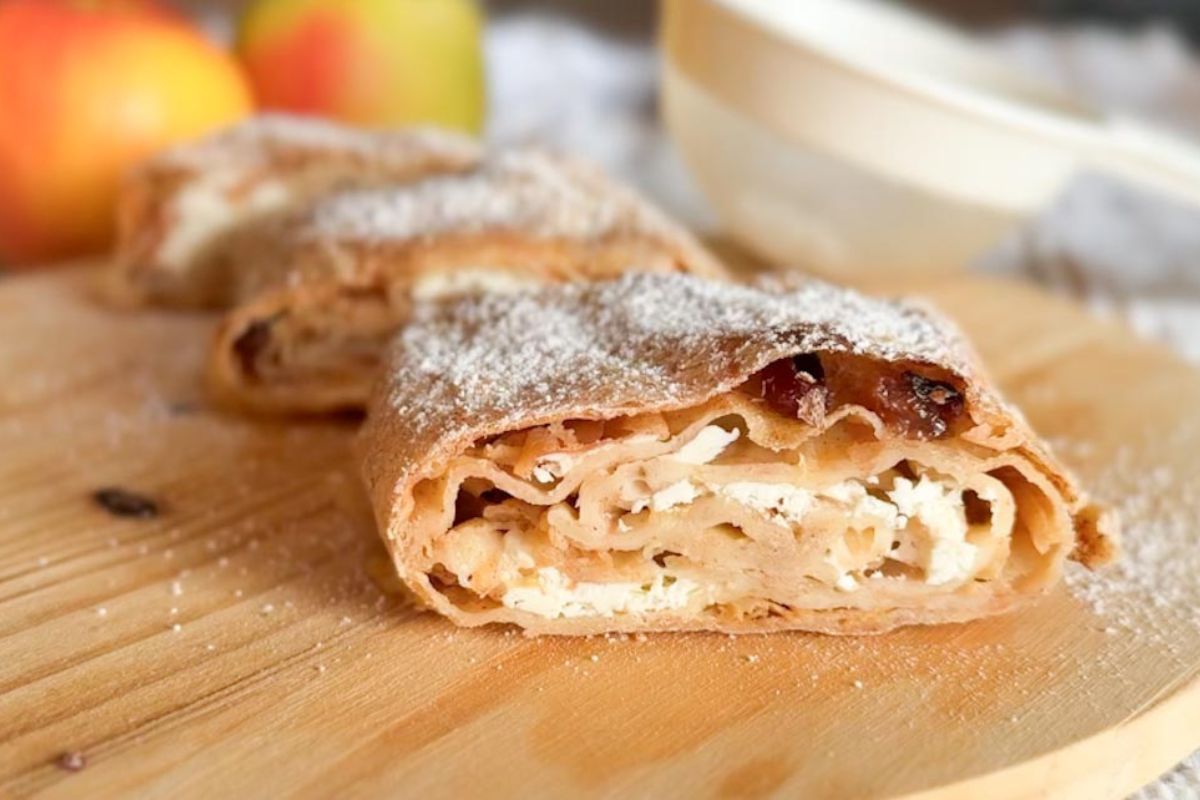Delicious apple cinnamon pastry with flaky crust and powdered sugar topping. Perfect for breakfast or dessert.