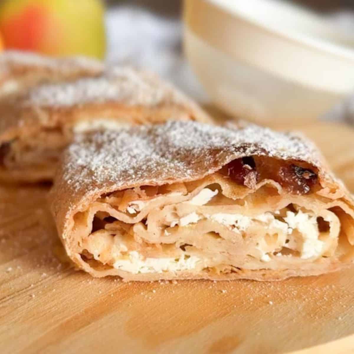 Delicious homemade apple cinnamon pastry made with fresh milled flour and dusted with powdered sugar. Perfect for breakfast or dessert.
