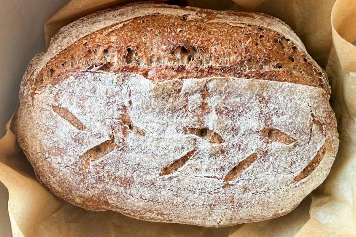 Artisan whole grain bread with freshly milled flour, crusty and nutritious, perfect for healthy eating.
