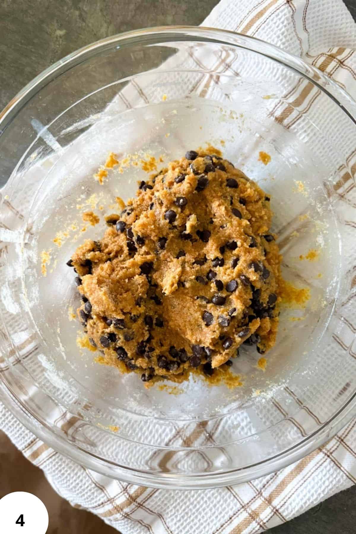Delicious cookie dough with chocolate chips, perfect for baking fresh cookies or snacks.