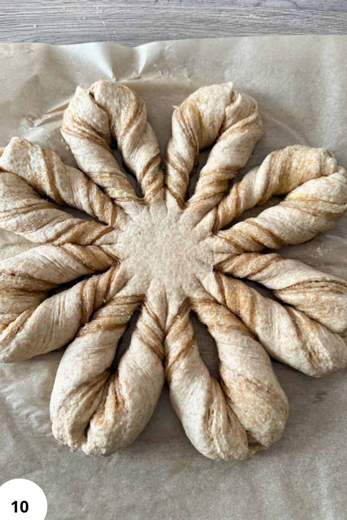 Artisan bread made with freshly milled flour, showcasing homemade dough twisted into a beautiful star shape.