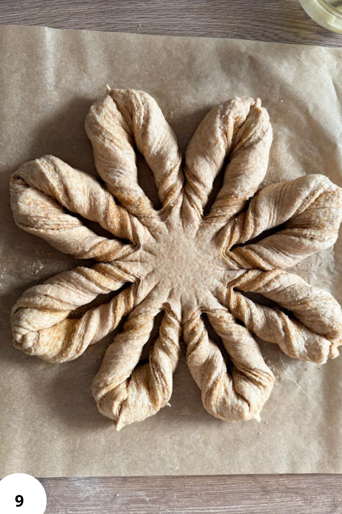 Handmade bread with fresh milled flour, expertly braided for a rustic look. Perfect for healthy baking and whole grain recipes.