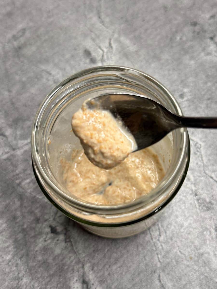 Sourdough starter made with fresh milled flour in a glass jar.