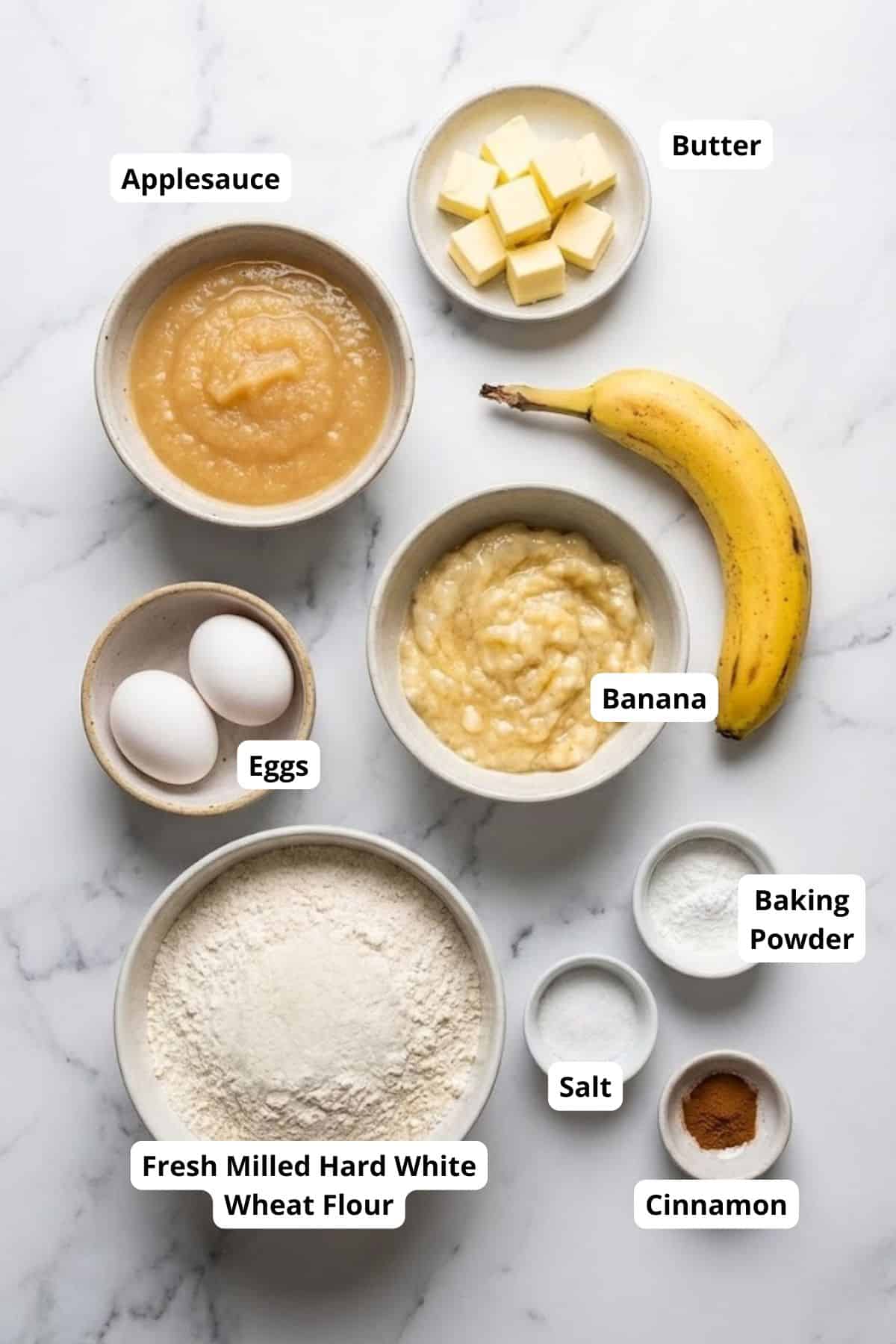 Healthy banana muffin recipe with applesauce, eggs, butter, and whole wheat flour.