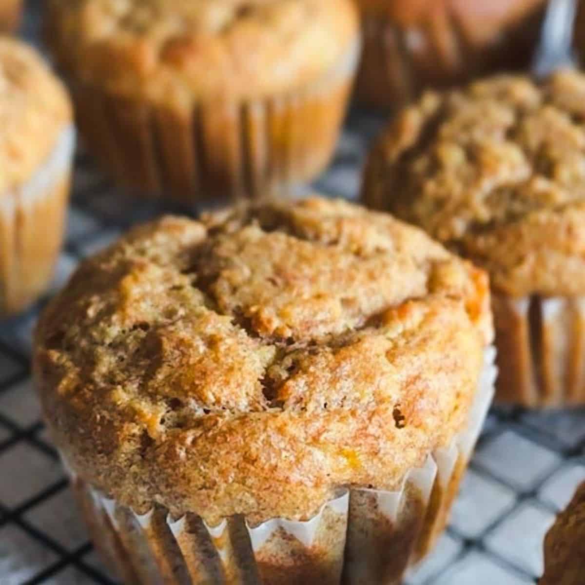 Delicious homemade banana muffins made with fresh milled flour and applesauce, perfect for breakfast.