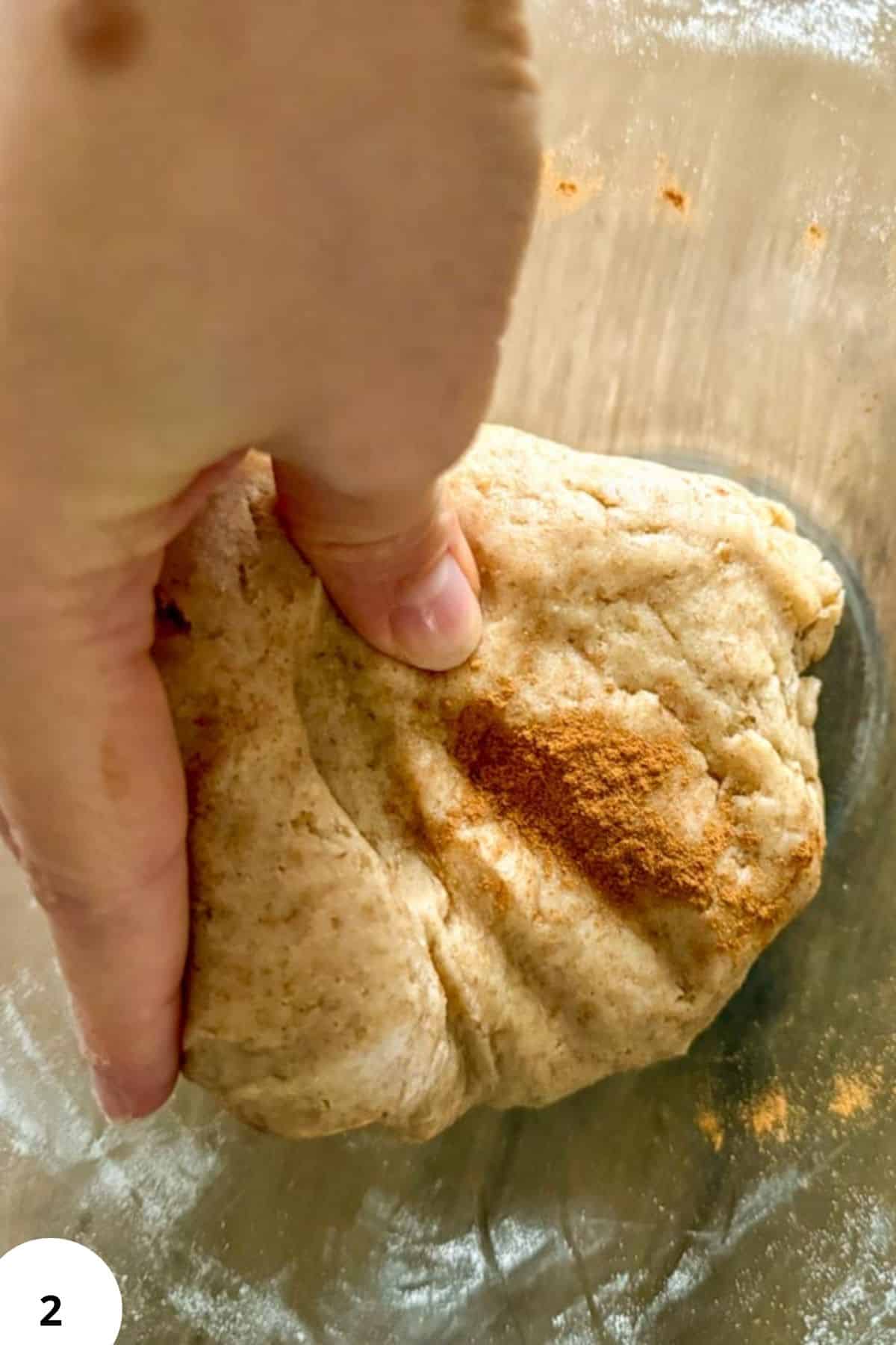 Close-up of homemade cinnamon-infused cereal dough ready for baking on a wooden surface.