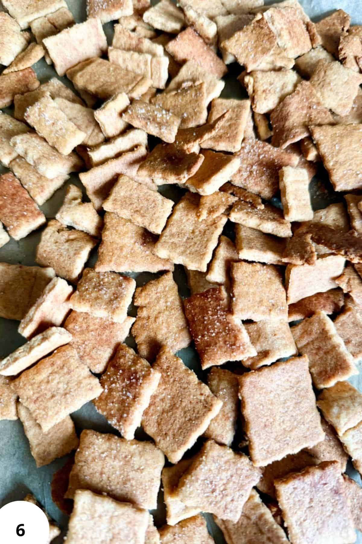 Crispy homemade cinnamon toast cereal squares with sugar, spices, and crunchy texture.