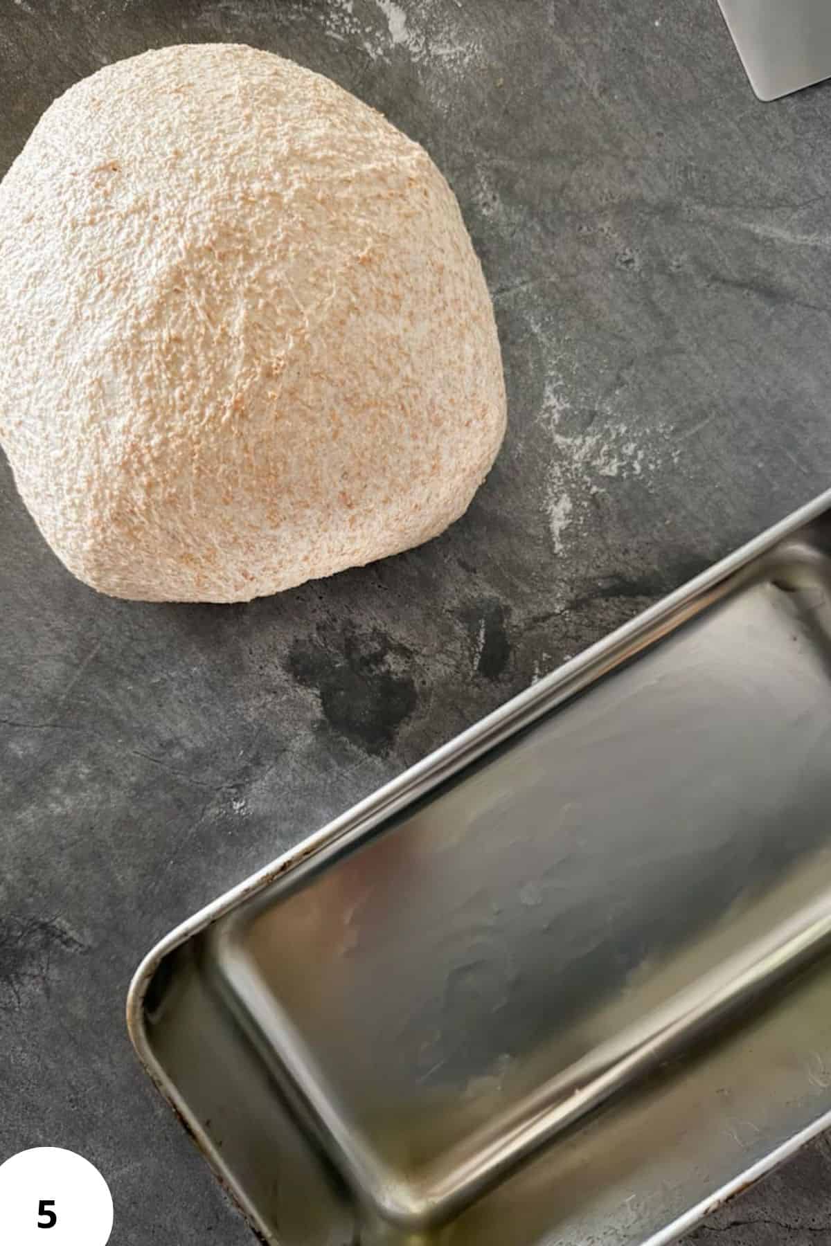 Fresh milled sourdough dough ready for baking in a loaf pan.