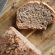 Sourdough bread made with fresh milled flour in a loaf pan, showcasing the two-pan baking method. Pe.
