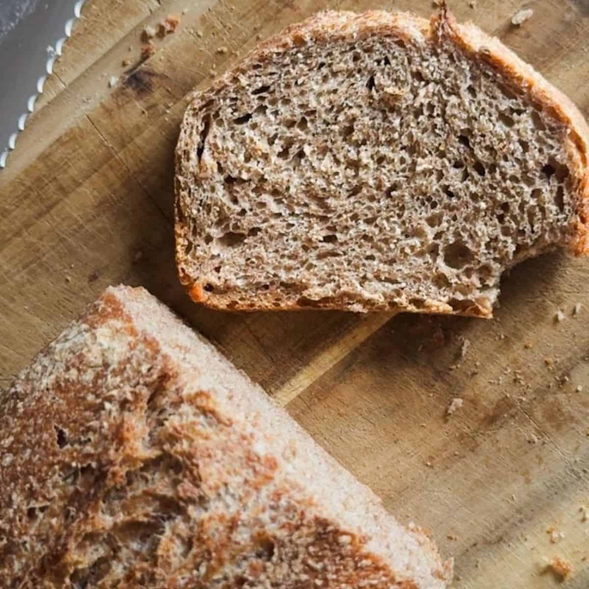 Sourdough bread made with fresh milled flour in a loaf pan, showcasing the two-pan baking method. Pe.