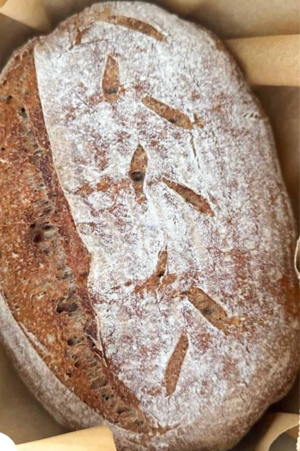 Fresh Milled Sourdough Bread with rustic crust and scoring design.