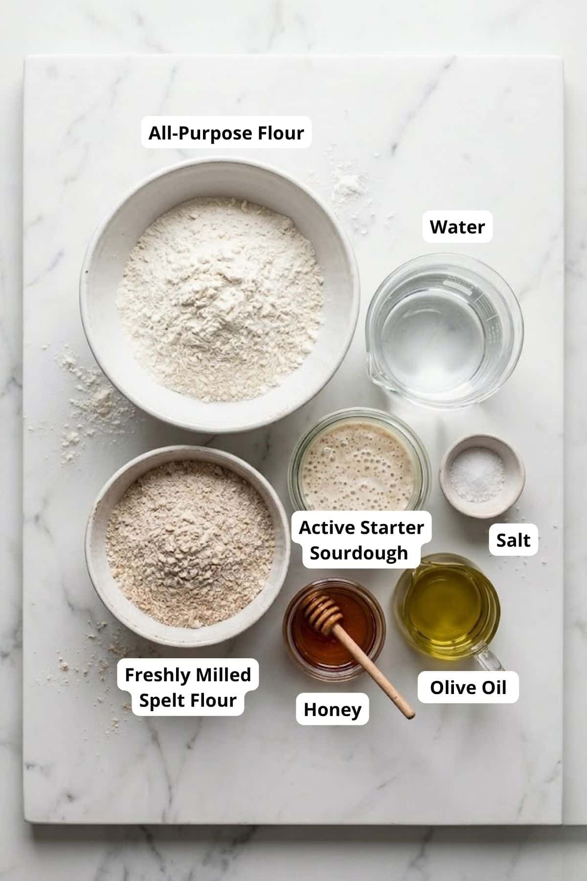 Ingredients for spelt sourdough bread rolls, including fresh milled spelt flour, active starter, wat.