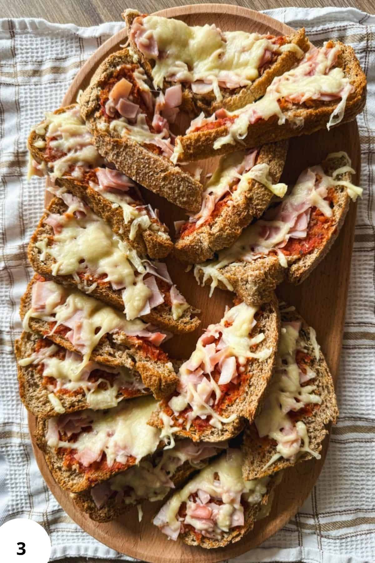 Cheesy ham toasts with fresh milled bread, melted cheese, and savory ham slices, perfect for a heart.