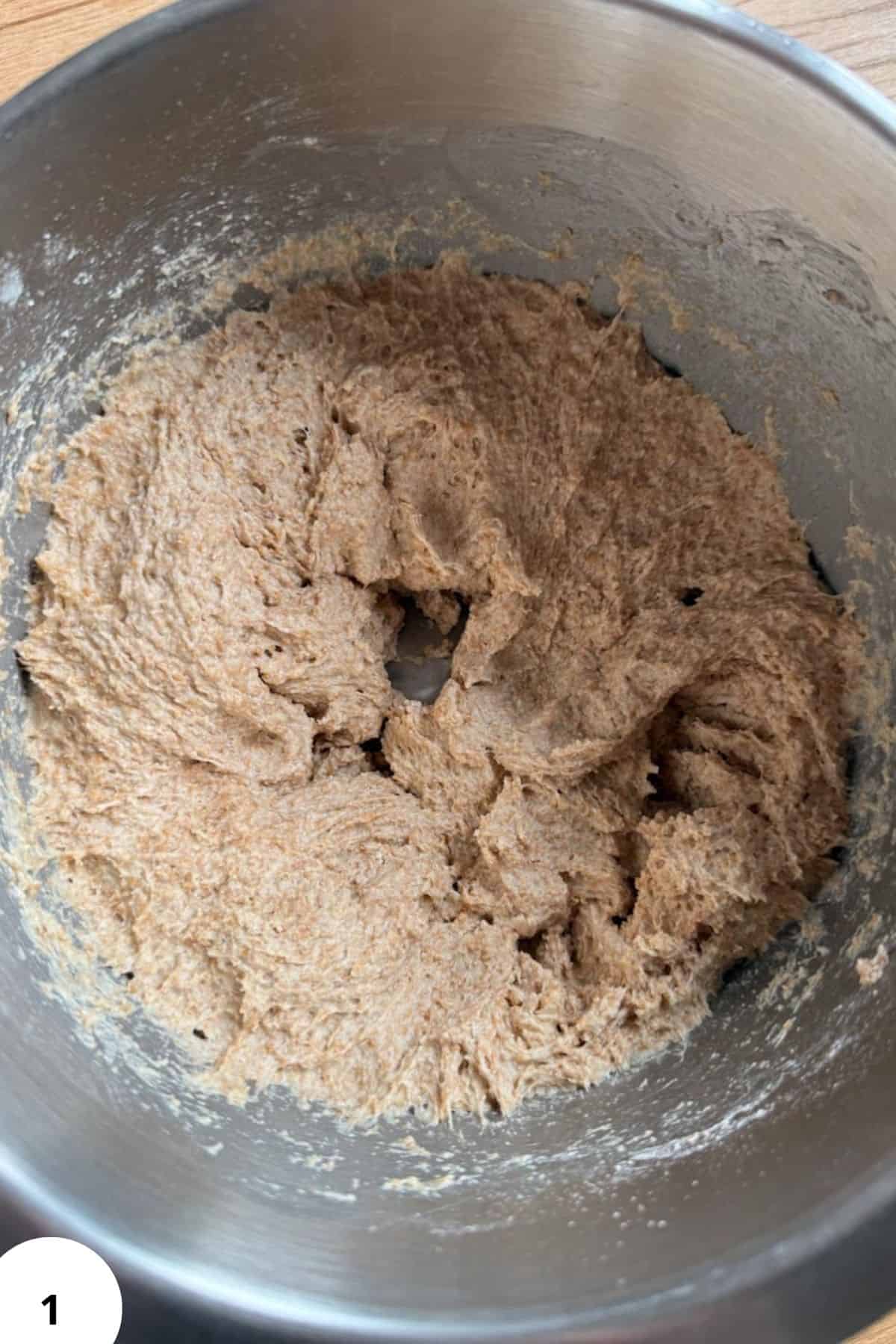 Fresh-milled sourdough bread dough in mixing bowl for homemade sandwich bread.