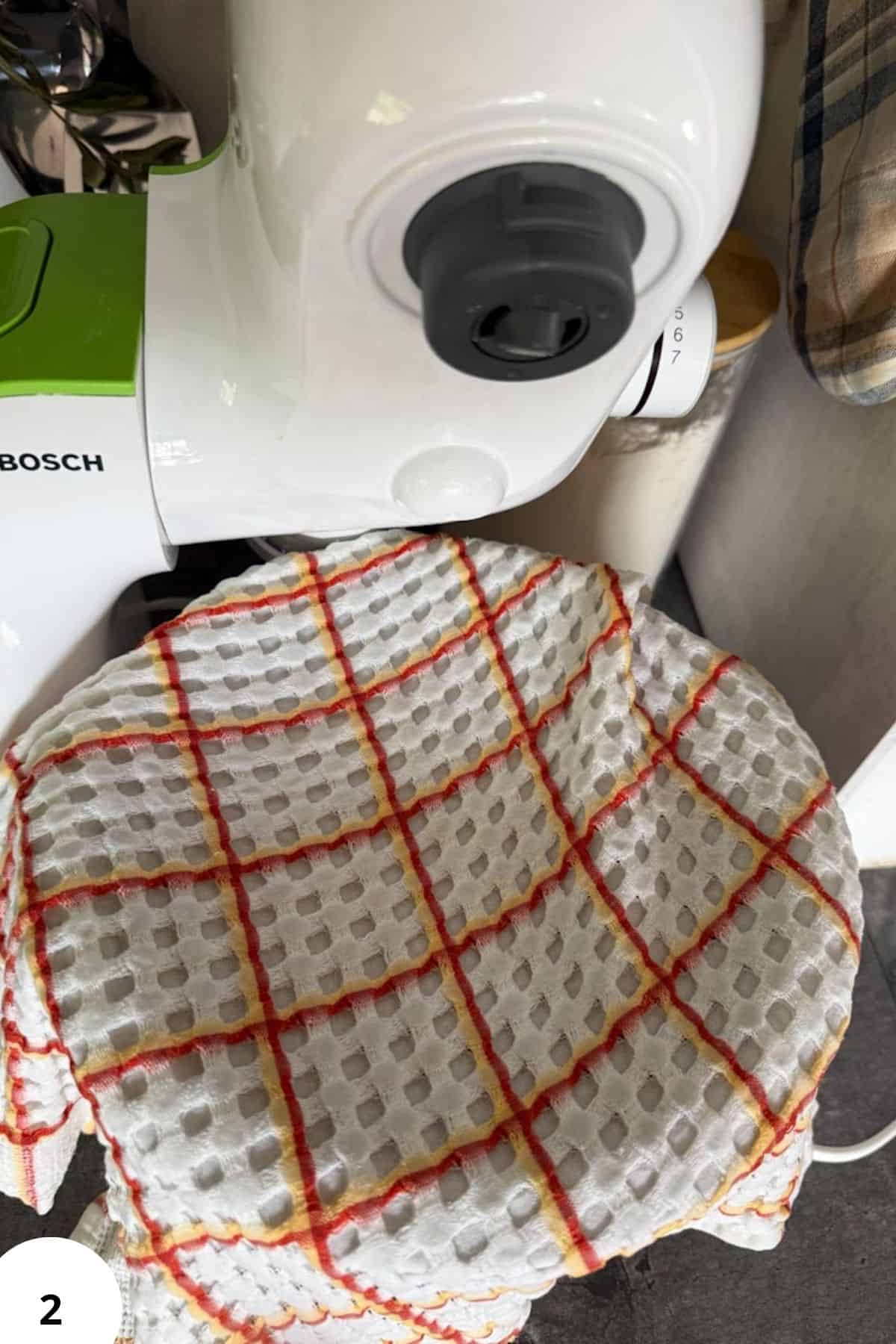 Freshly milled sourdough bread dough in a bread machine for homemade sandwiches.