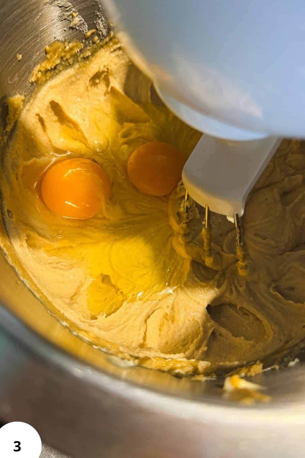 Freshly milled peanut butter with eggs in a mixing bowl for cookies.