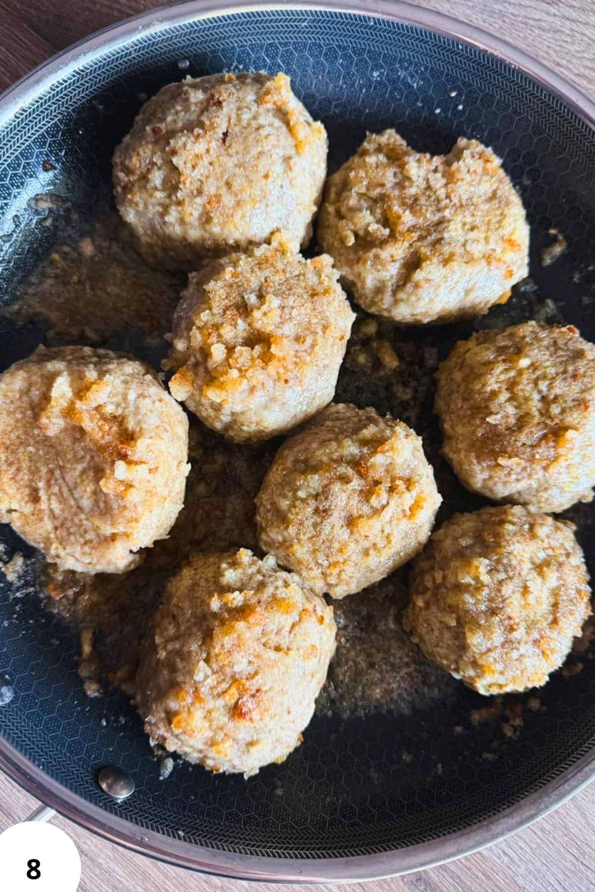 Freshly made grain balls coated with breadcrumbs, perfect for healthy snacks or meals.