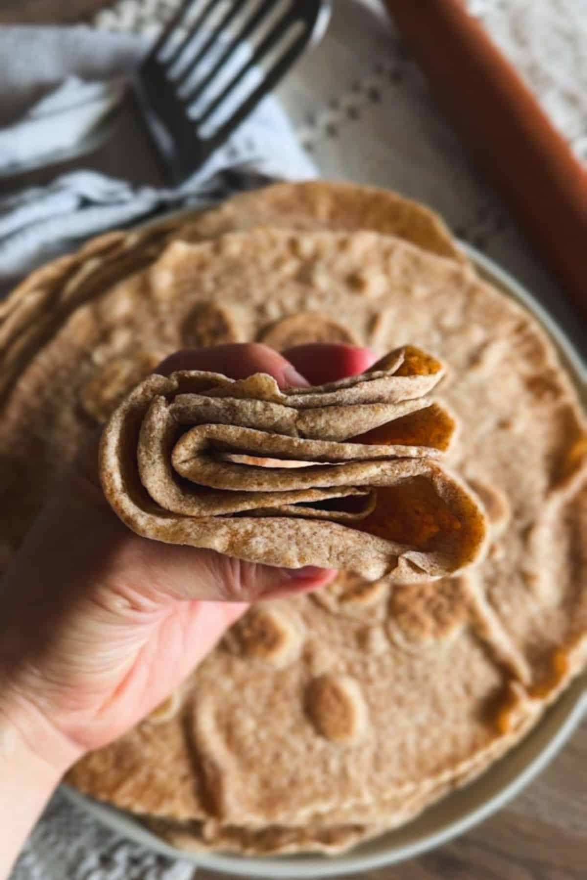 Freshly baked whole wheat flatbread made with freshly milled grains, perfect for healthy meals.