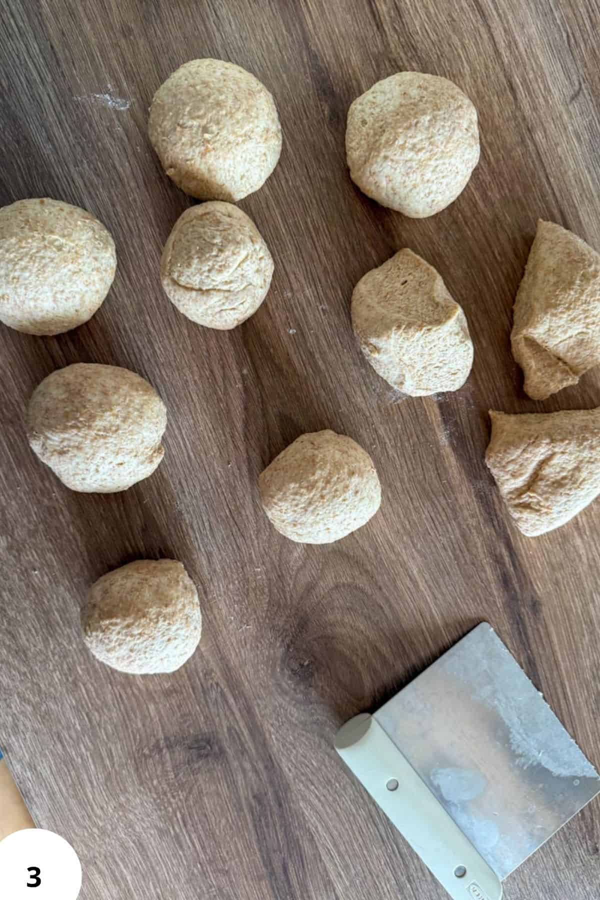 Assorted natural flour boulders on wooden surface for fresh milling recipes.