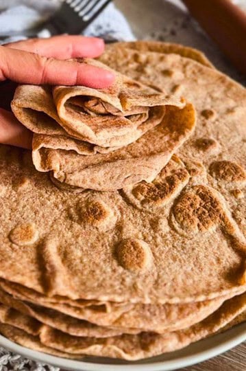 Freshly baked whole wheat flatbreads made from freshly milled grains.