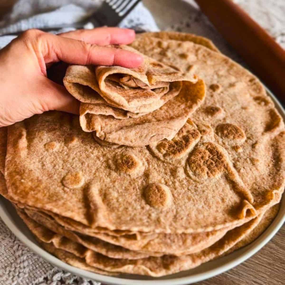 Freshly baked whole wheat flatbreads made from freshly milled grains.