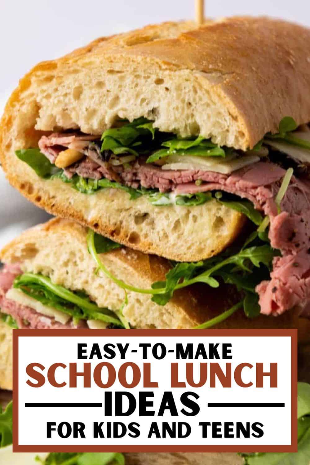 Freshly baked bread sandwich with roast beef, greens, and fresh ingredients.