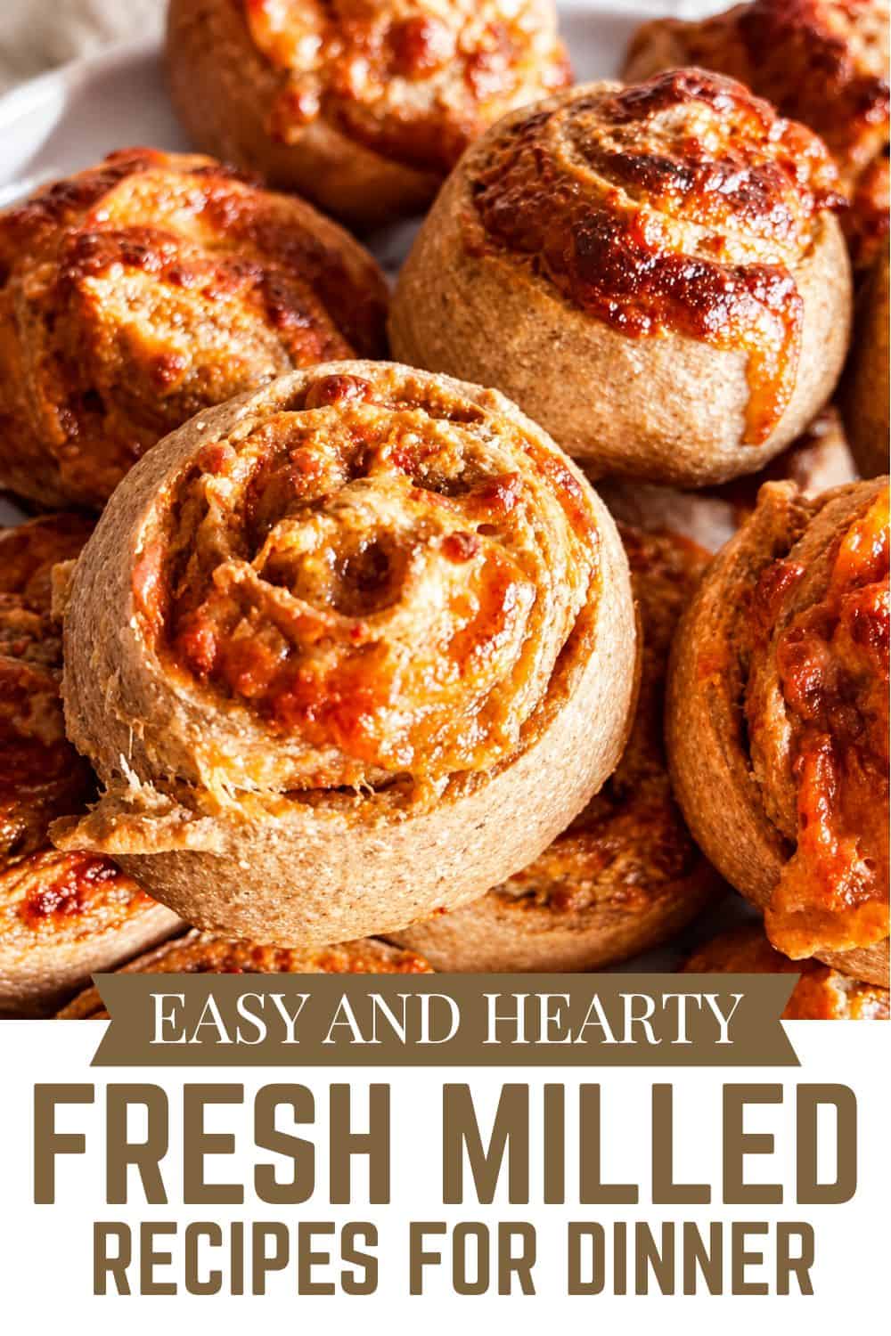 Freshly baked bread rolls with a golden crust, perfect for dinner.
