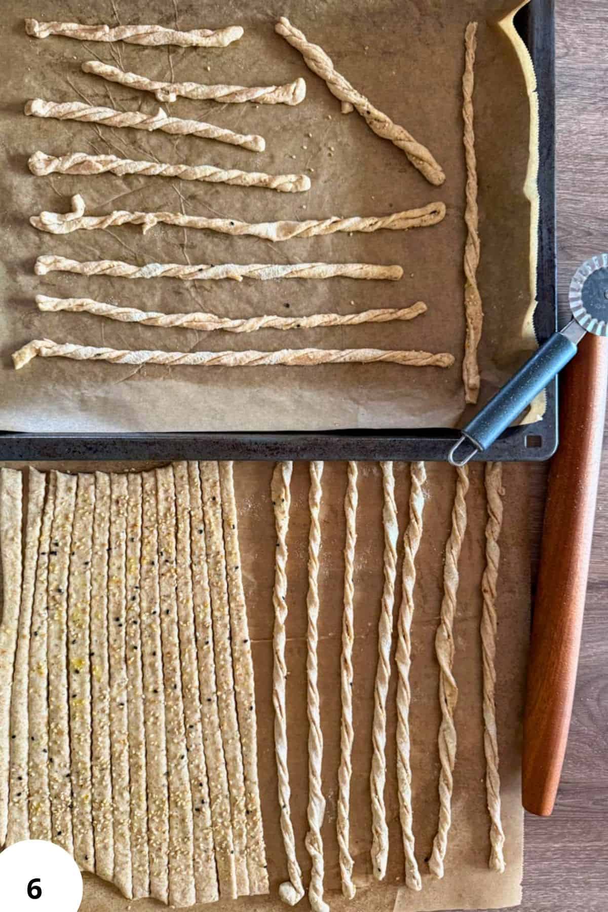 Homemade breadsticks and crackers made with fresh milled flour on baking sheets, ready for baking or.