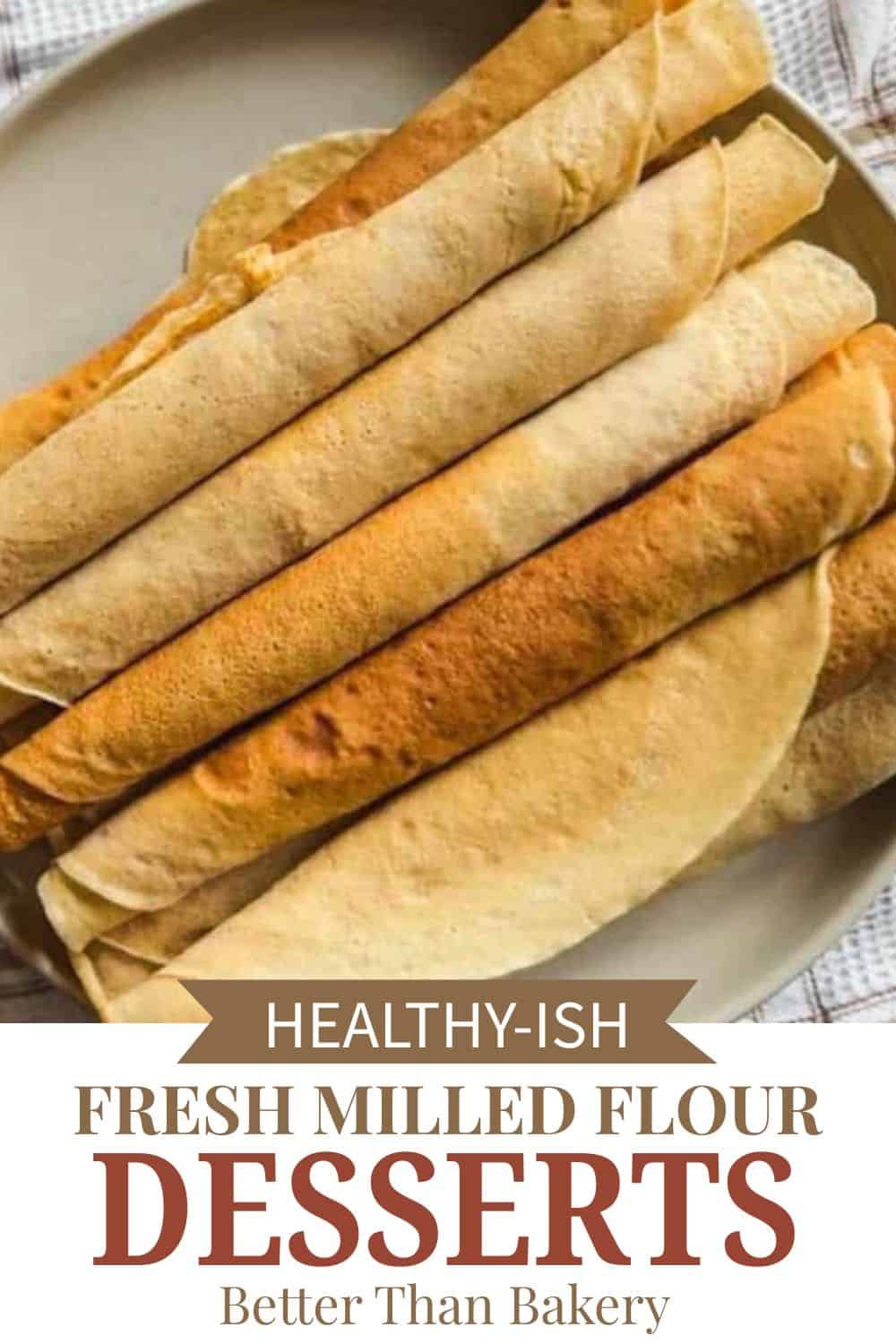 Assorted fresh milled flour wraps and baked desserts on a plate, highlighting healthy baking options.