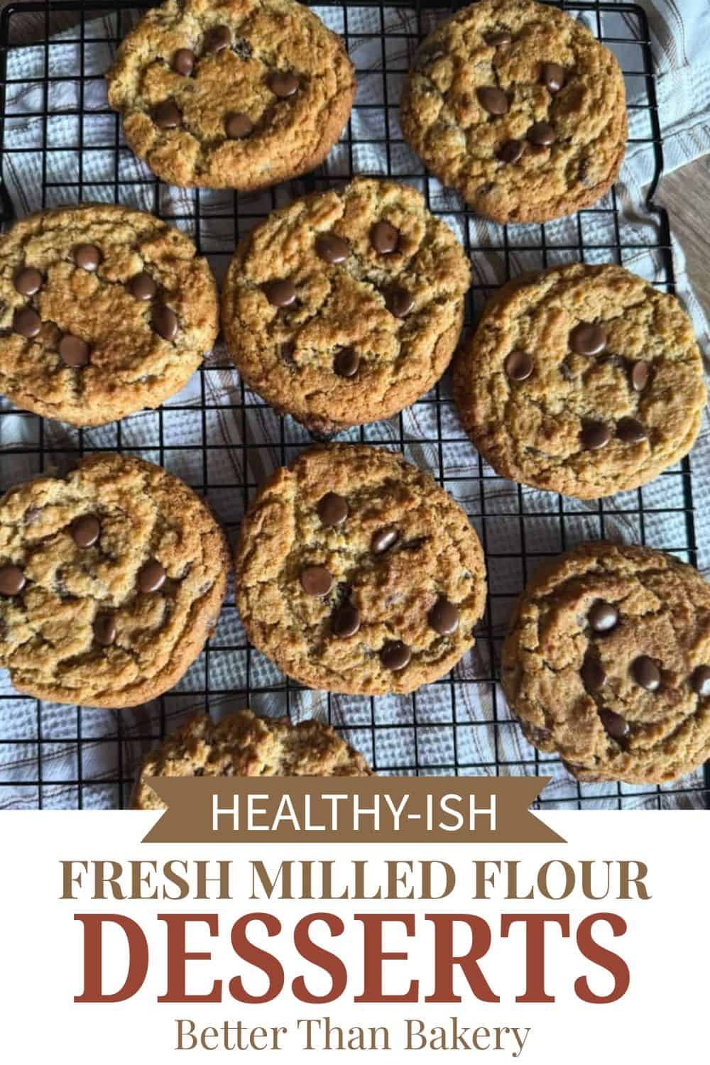 Freshly baked cookies with chocolate chips on a cooling rack, showcasing healthy ingredients.