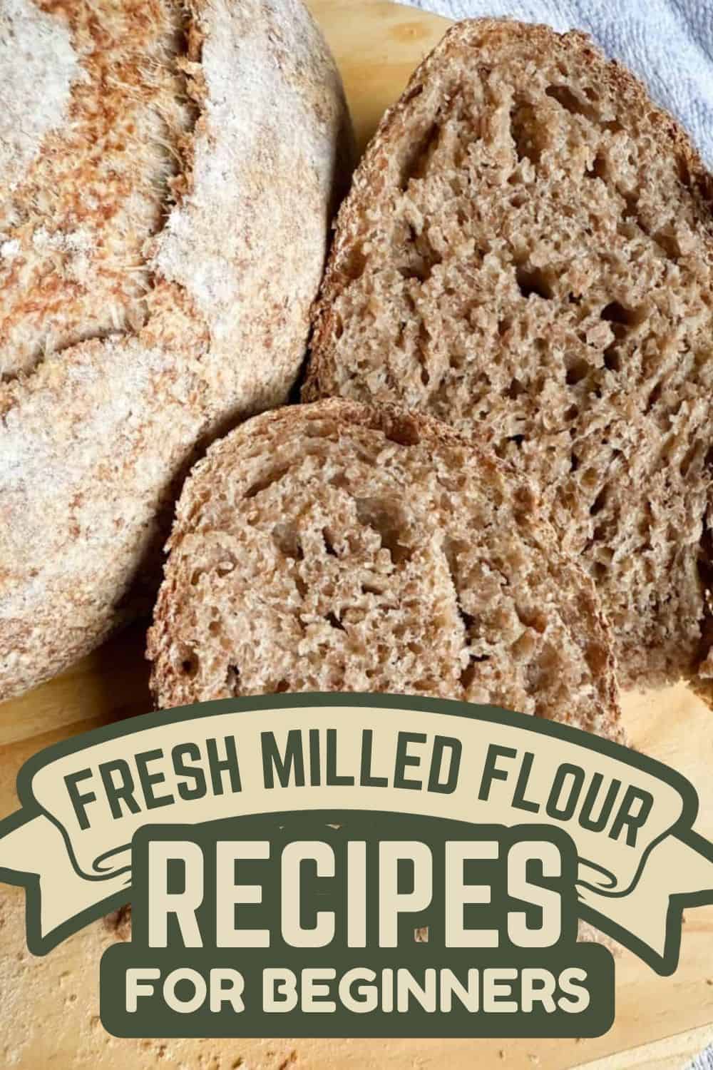 Freshly baked bread made with freshly milled flour on a wooden surface.