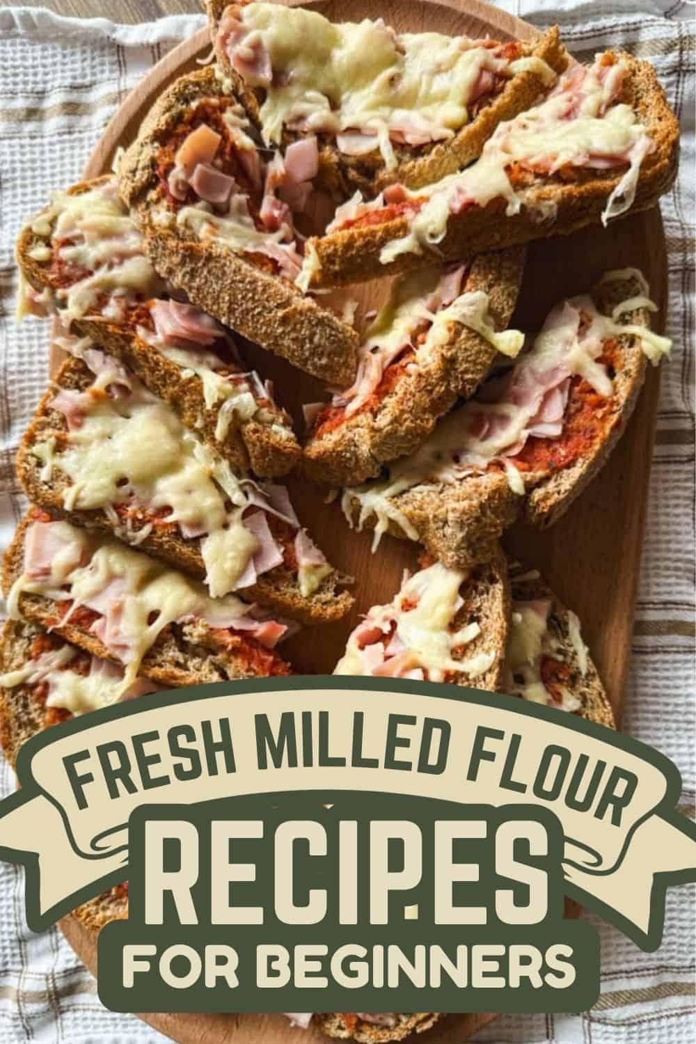 Delicious homemade bread slices with melted cheese and ham on a wooden plate.