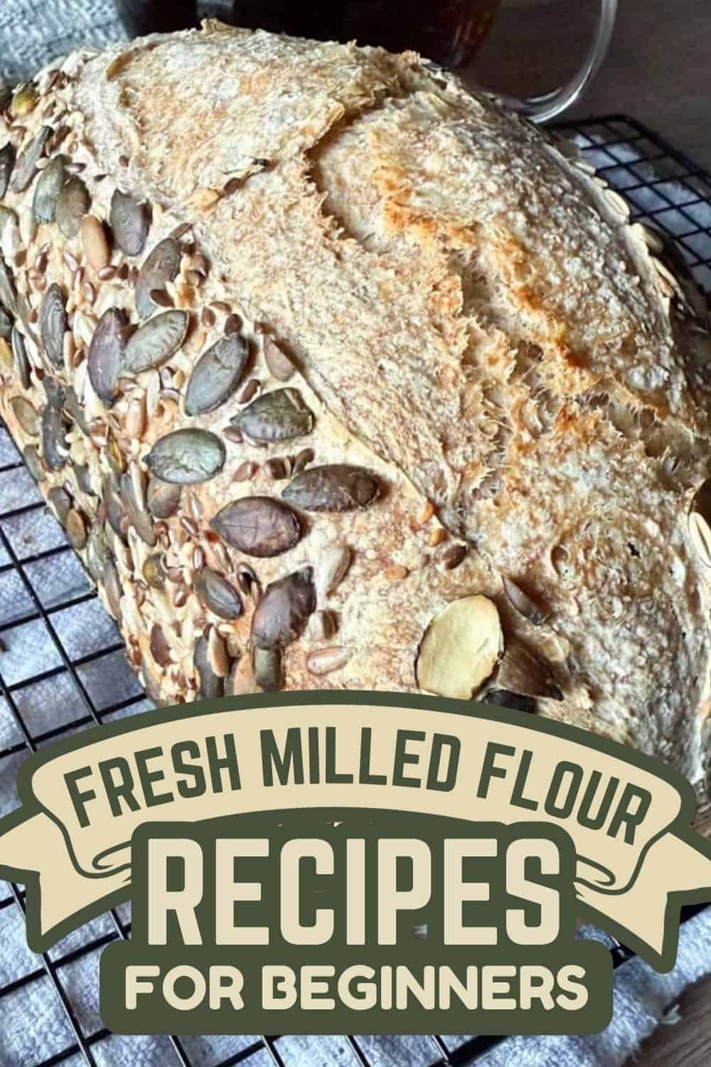 Freshly baked bread with pumpkin seeds and flour dust on top.