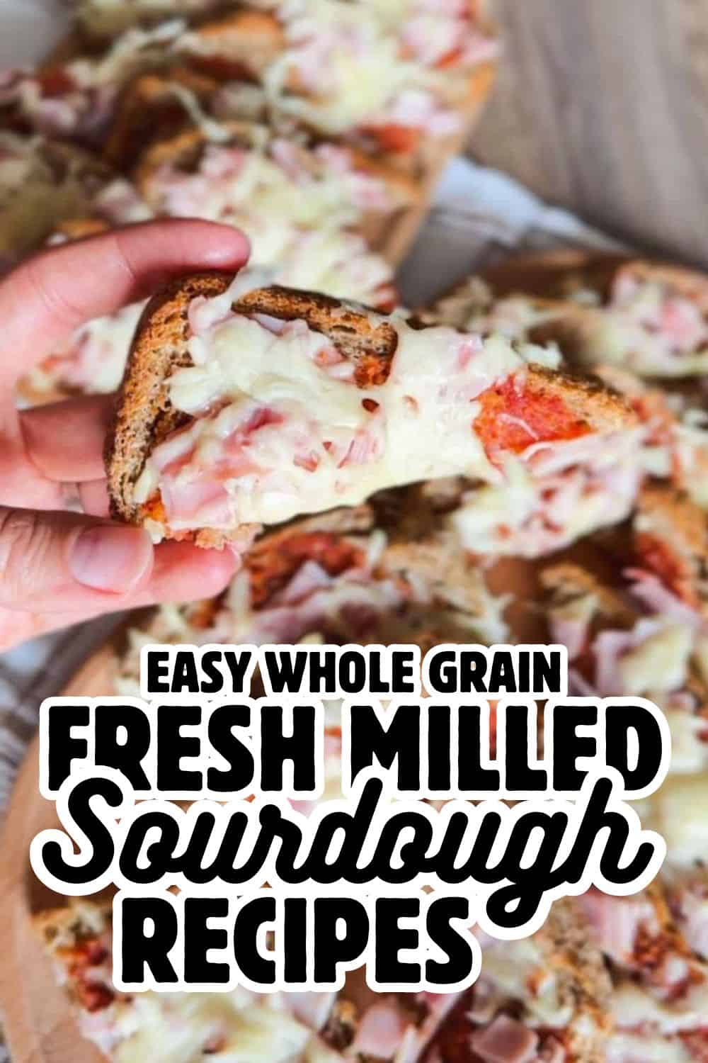 Delicious homemade sourdough bread with melted cheese and fresh ingredients.