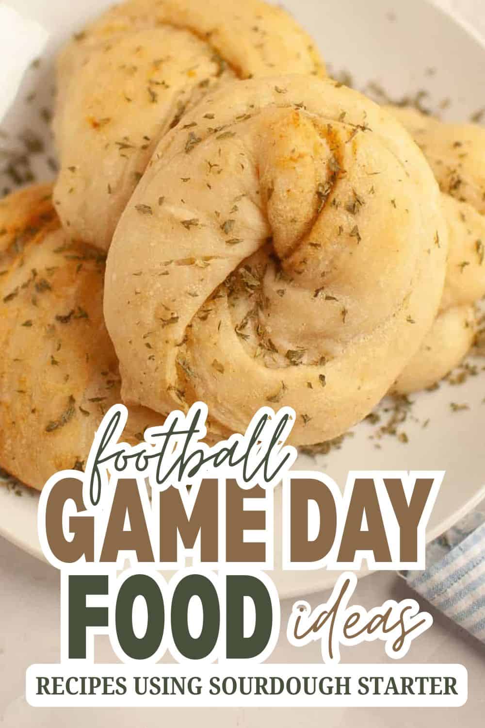 Homemade sourdough bread rolls with herbs for game day recipes.